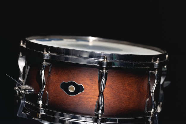 Closeup snare drum on a dark background isolated