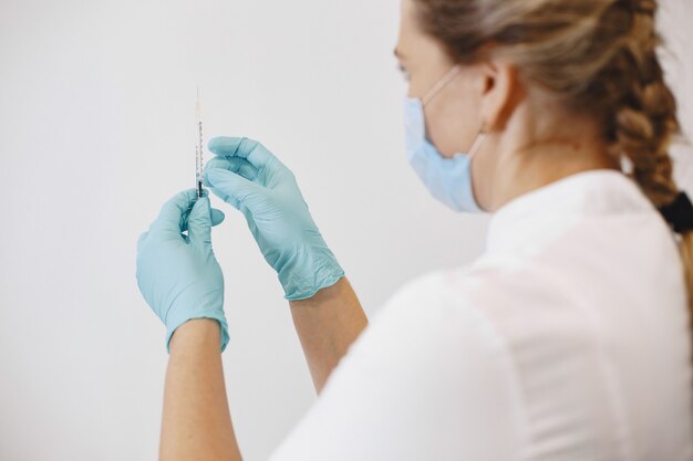 Closeup of syringe and injection vial flu. Measles, coronavirus, covid-19 vaccine disease prepare for human.