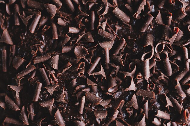 Closeup of tasty chocolate cake with chocolate chunks on baking sheet. Closeup.