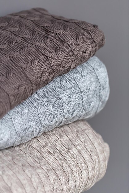 Free photo closeup of textured knitted blankets in a stack