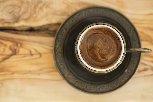 Closeup of Turkish coffee served in a traditional cup
