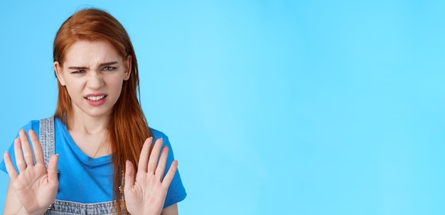 Free photo closeup uninterested displeased ignorant picky redhead girlfriend frowning make disgusted grimace ra