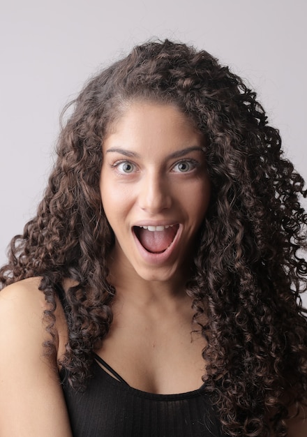 Free photo closeup vertical shot of a female with a surprised face isolated