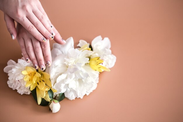 Closeup view of woman with beautiful hands on color background, space for text