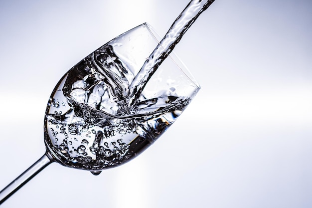 Closeup of water splashing in a glass