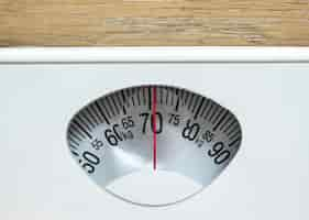 Free photo closeup of weight scales overweight and obesity concept