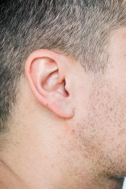 Closeup of white man&#39;s ear