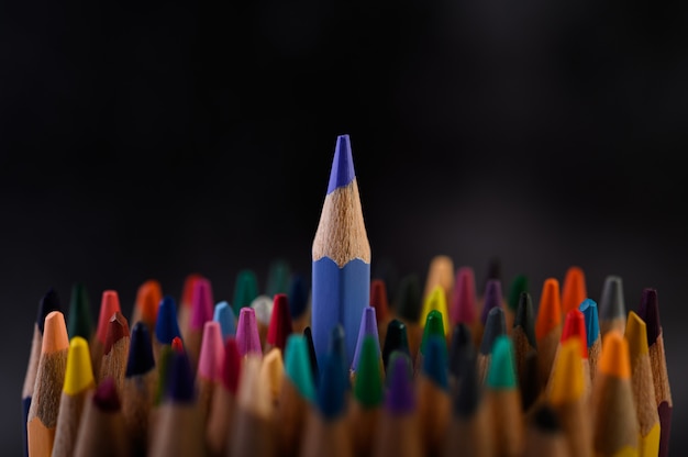 Closeup with a group of colored pencils, selected focus, blue