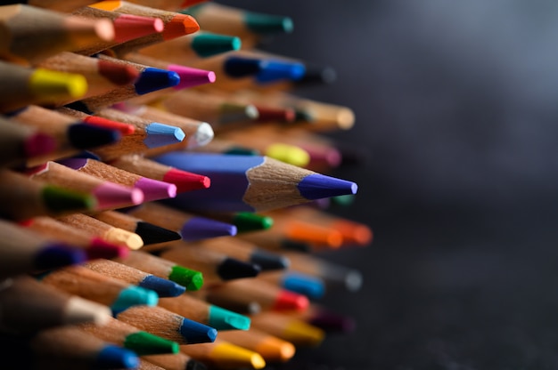 Closeup with a group of colored pencils, selected focus, blue