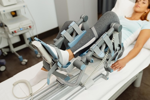 Closeup of woman during physical rehabilitation with arthromot device