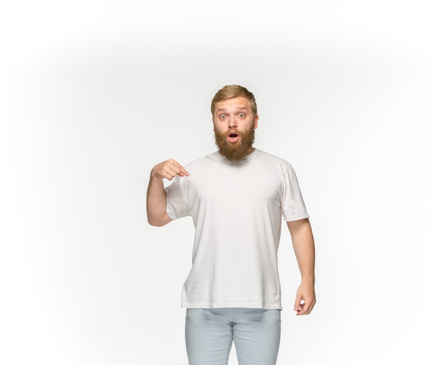 Free photo closeup of young man's body in empty white t-shirt isolated on white space. mock up for disign concept