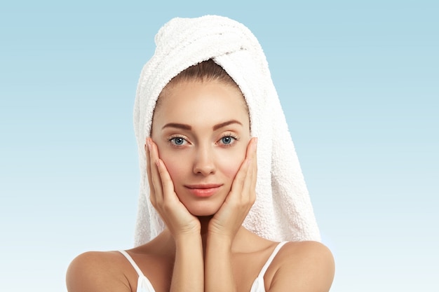 Closeup of young woman with towel on head