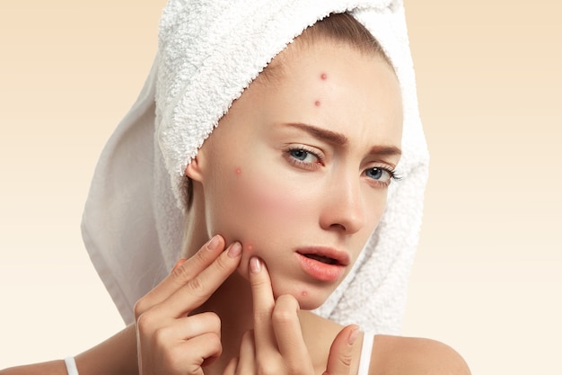 Closeup of young woman with towel on head