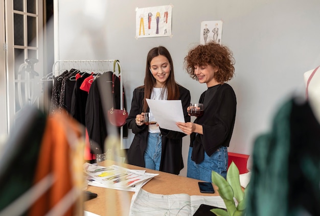 Clothes designers working at store