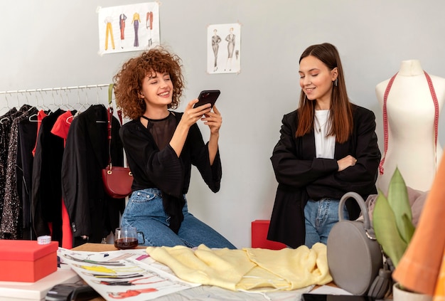 Clothes designers working at store