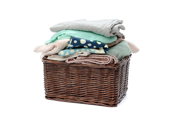 Free photo clothes in a laundry wooden basket isolated on white background