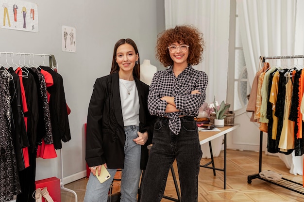 Free photo clothes store employees working