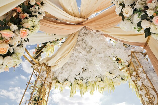 Clothes twined under the top of wedding altar