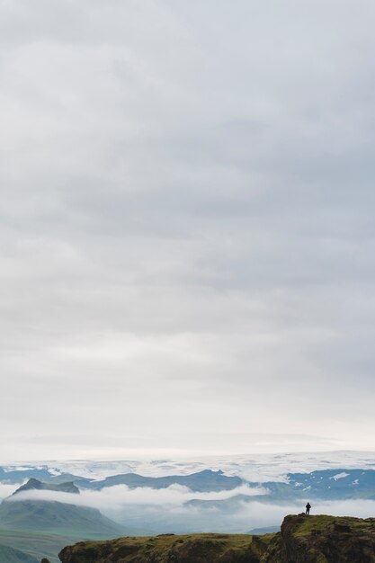 Cloudy nature landscape by lake