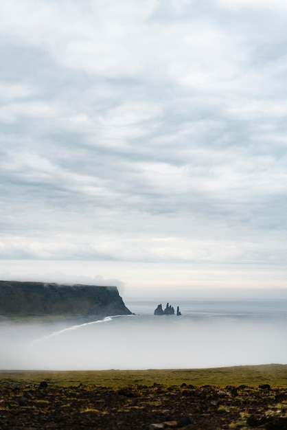 Cloudy nature landscape by lake