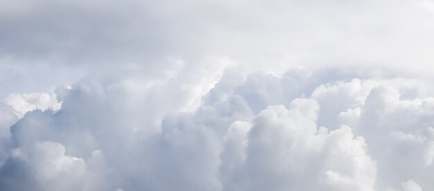 Cloudy sky background sunlight shining through the white clouds