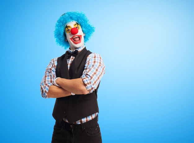 Clown smiling with arms crossed