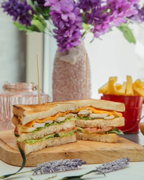 club sandwich served with french fries