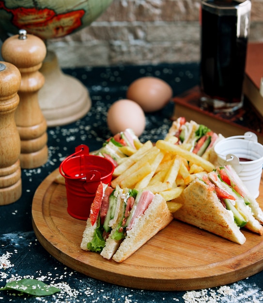 Club sandwich with french fries