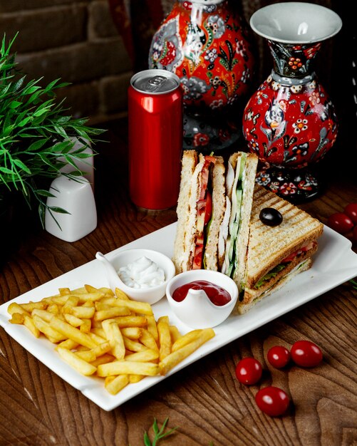 Club sandwich with french fries