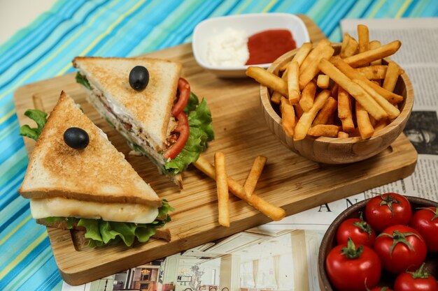 Club sandwich with french fries