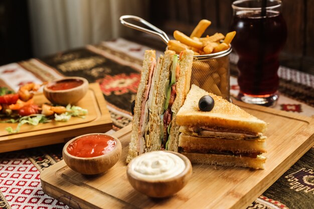 Club sandwich with french fries