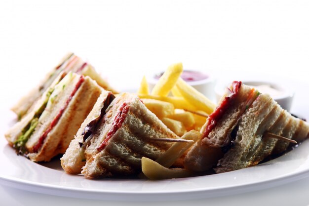 Club sandwich with meat and green