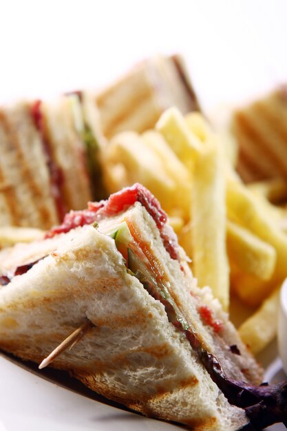 Club sandwich with meat and green