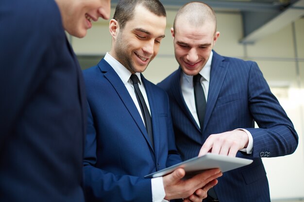 Co-workers reviewing the report