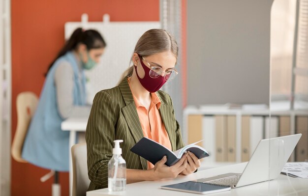 Co workers wearing face mask at work