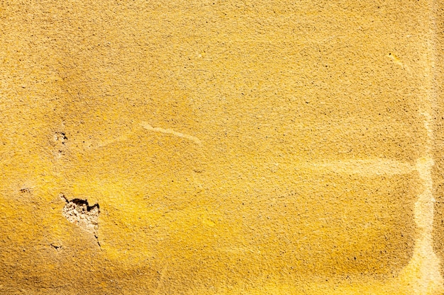 Free photo coarse yellow cement surface