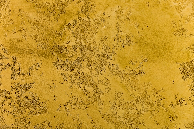 Грубая желтая цементная поверхность стены