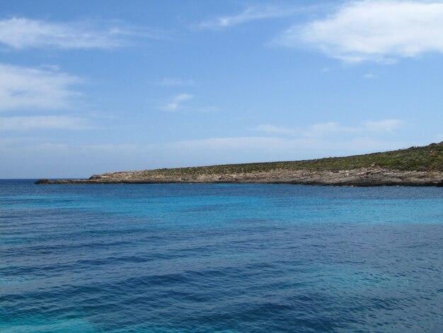 Coastline of Comino, Malta under a blue sky