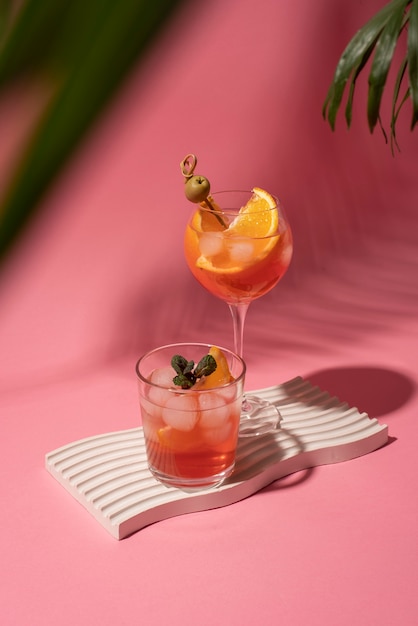 Cocktail glasses with ice cubes and olives