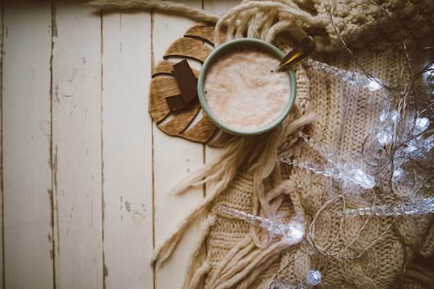 Free photo cocoa with lights cozy winter home warm background