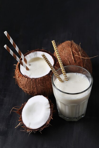 Coconut cocktail with straw. Tropical drink