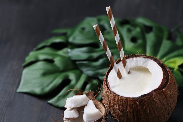 Coconut cocktail with straw. Tropical drink