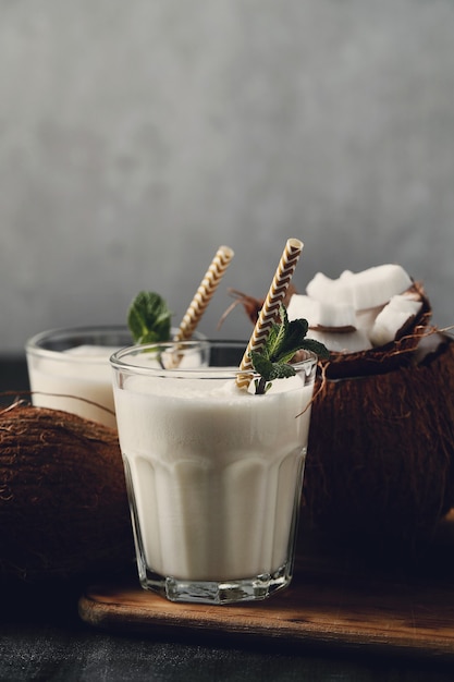Coconut cocktail with straw. Tropical drink