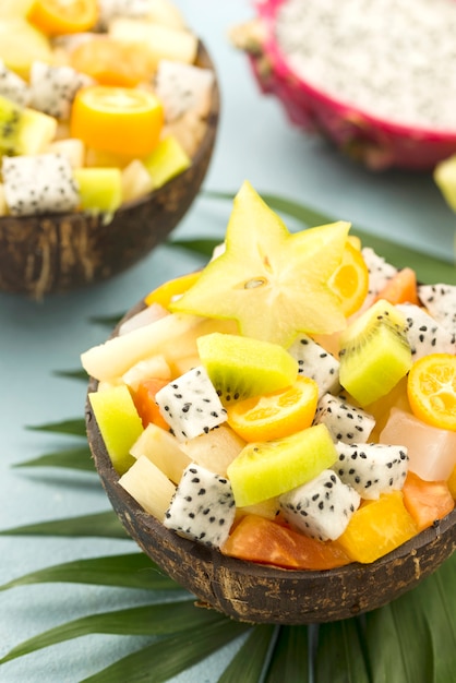 Coconuts filled with fruit salad high view