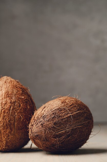 Coconuts over wooden table