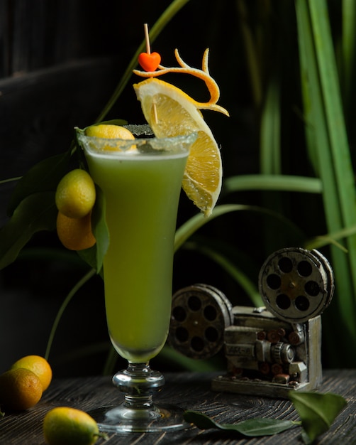 Coctail with kinkan and slice of lemon