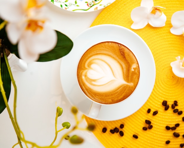 coffe latte flowers beans top view