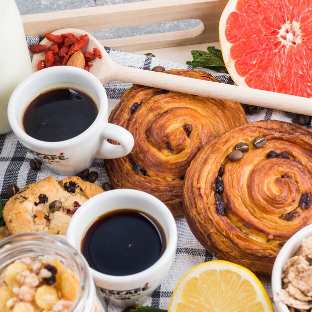 Coffee and baked cookies with citrus fruit