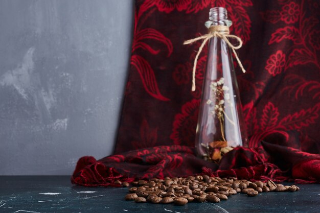 Coffee beans on blue table.