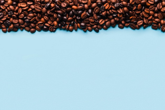 Coffee beans on blue